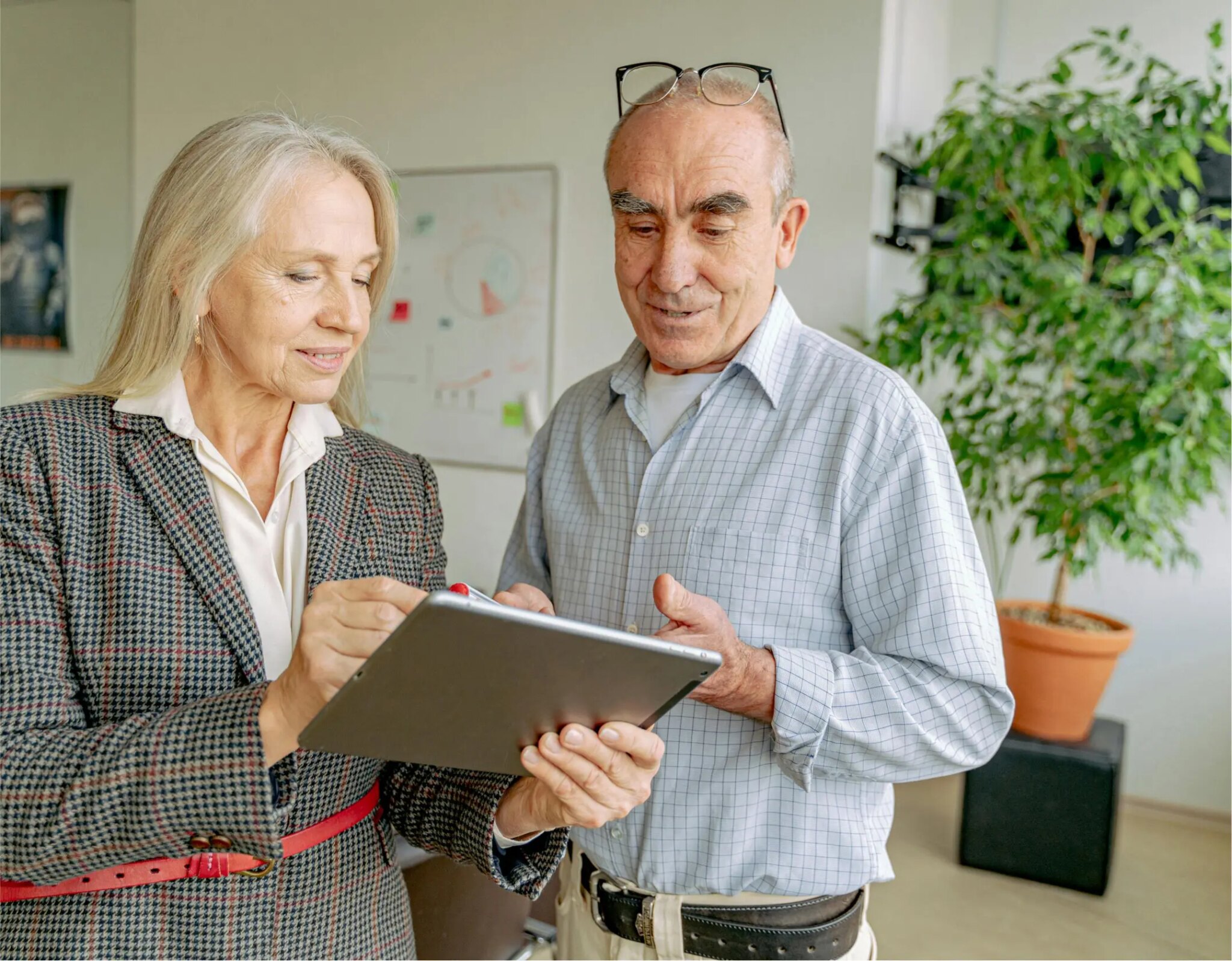 Two people discussing work in an office.