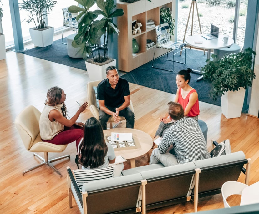 Group meeting in modern office setting.