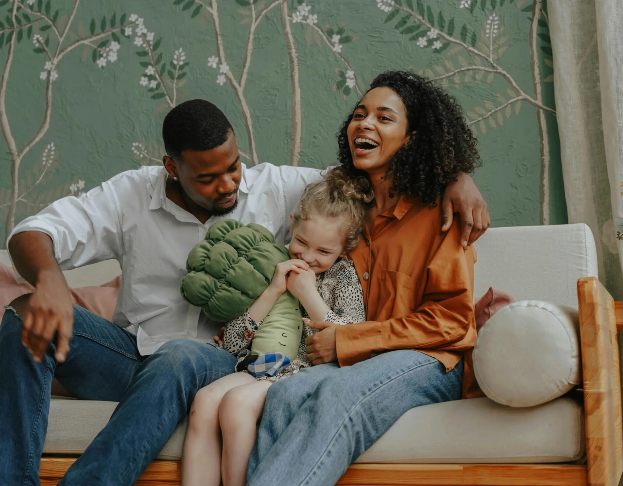 Family enjoying time together on couch.