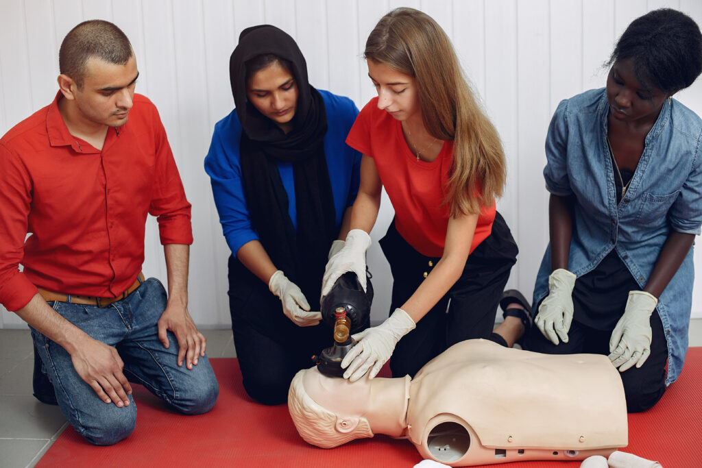 CPR training session with medical mannequin.
